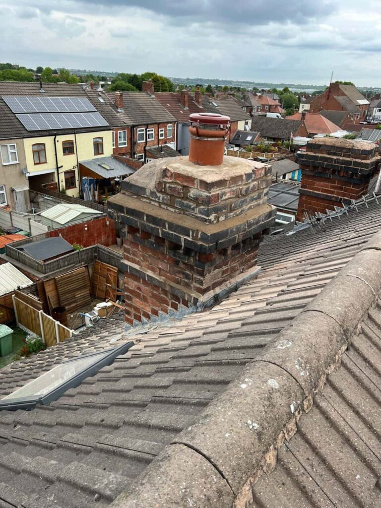 This is a photo taken from a roof which is being repaired by Burwell Roofing Repairs, it shows a street of houses, and their roofs